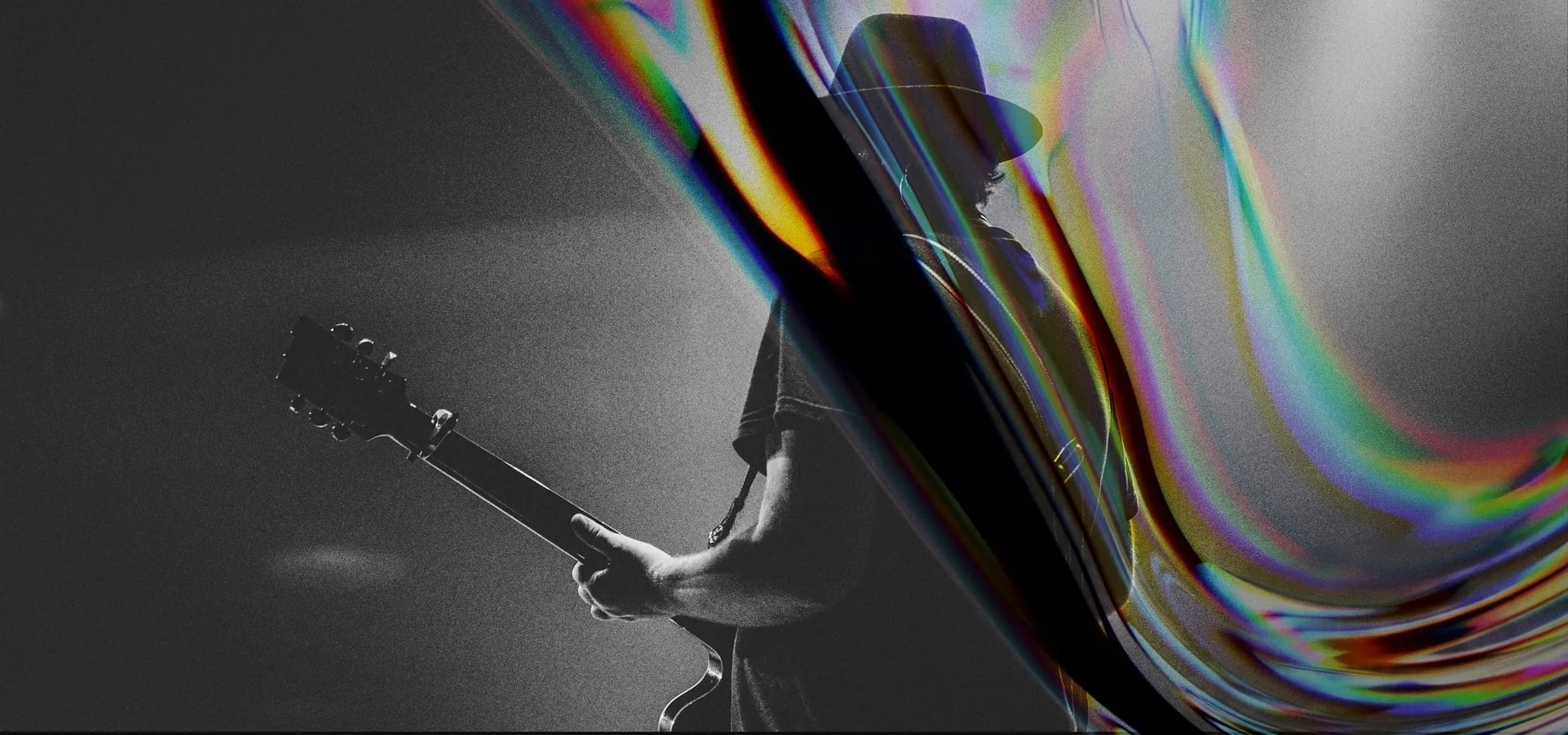 Guitarist on stage under a spotlight, from the xRoads launch campaign